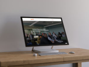 desktop all-in-one computer on a wood desk