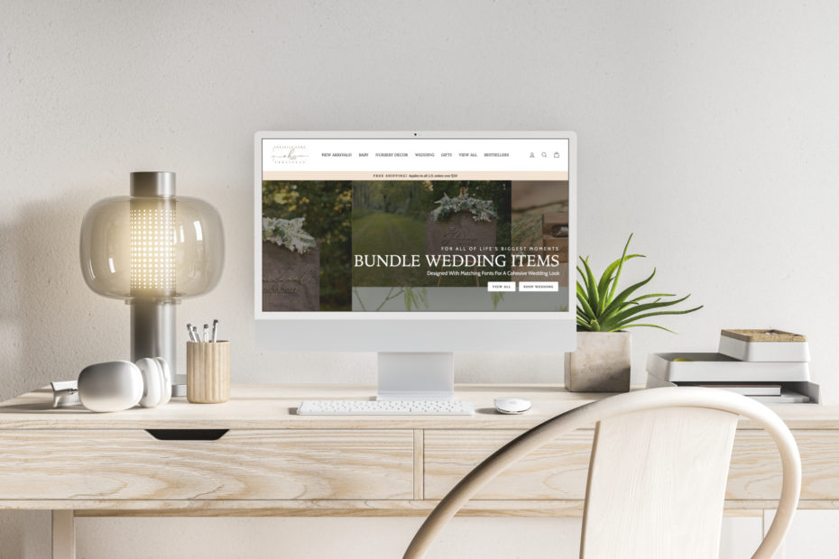 imac on a light wood desk showing an example of a custom website